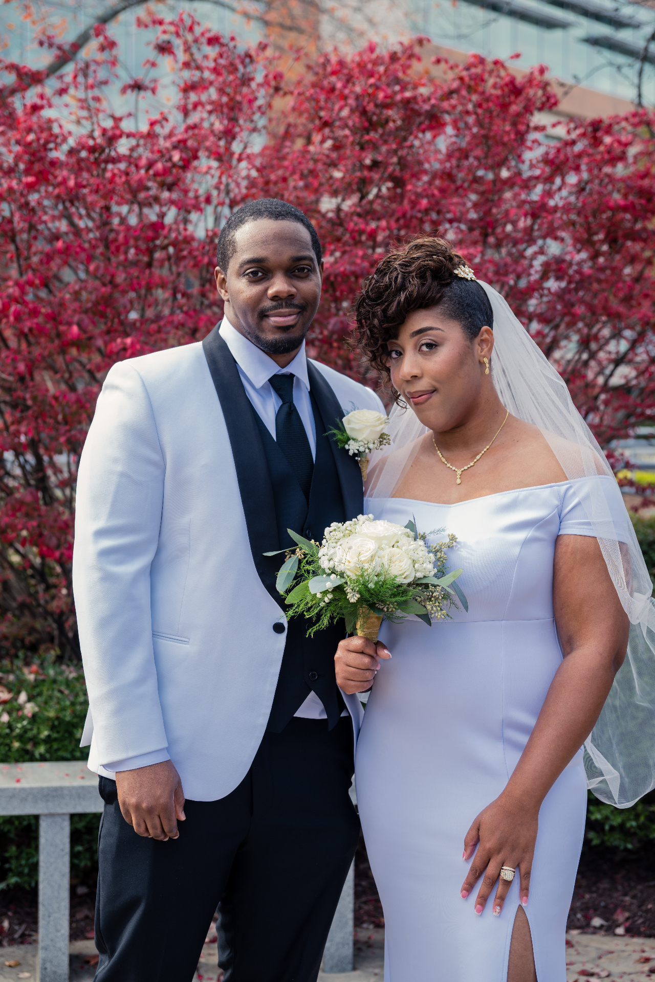Bryant and Ciarra in front of fall foliage
